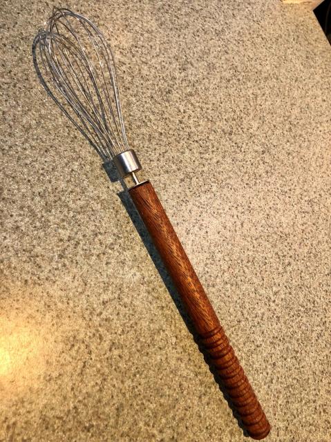 Electric whisk attachment now mounted on a wooden handle for manual use