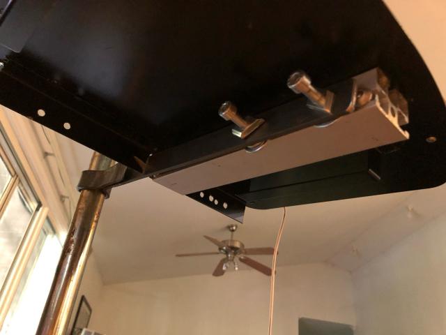 Underneath is a T-slot aluminium bar used as a sliding rail. 