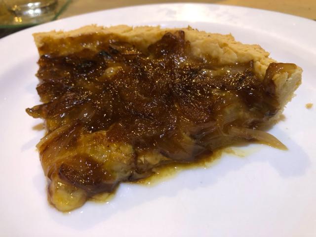 A slice of tart on a plate