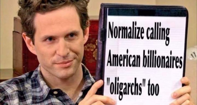The character Dennis Reynolds from "It's Always Sunny in Philadelphia" holding up a sign that says "Normalize calling American billionaires "oligarchs" too"