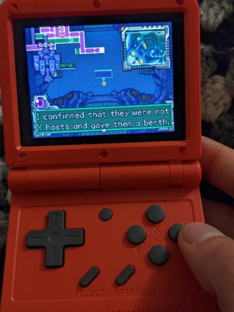 Metroid Fusion being played on an arm-based emulator console.