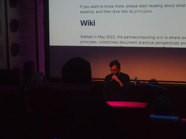me mumbling something about the permacomputing wiki, in front of a projection of the permacomputing wiki