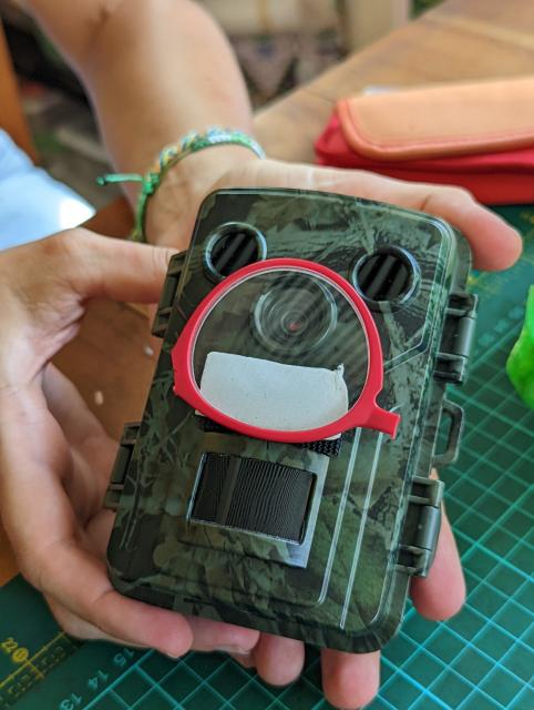 Camera trap with a monocle on made from reading glasses 