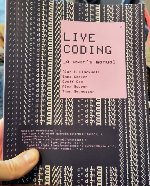 Book cover for 
LIVE CODING: a user's manual, by Alan F. Blackwell, Emma Cocker, Geoff Cox, Alex McLean and Thor Magnusson

With text 'live coding' in the background manipulated into a repeating pattern. The code for generating this pattern is also shown in a box, partially obscured by my thumb, saying something like:

function newPattern () {
var type = document.querySelectorAll('path'), i; currentScale = 1;
currentTime = setInterval( function() {
for (i = 0; i < type.length; ++i) ( type[i].style.transform='scale('+ currentScale +)'; currentScale = Math.random() * 2;
}
}