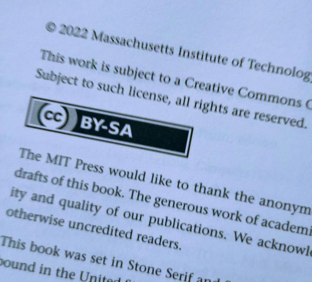 Photograph of copyright page from the front of the book, focussing on creative commons attribution sharealike (cc-by) license logo.