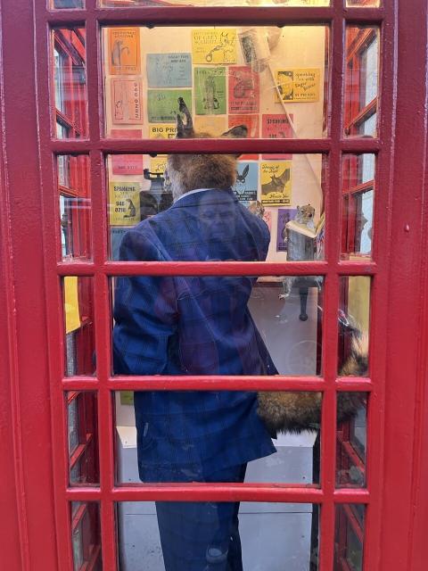 Art installation of a stuffed fox using a phonebooth in London - with pastiche vice cards advertising animals