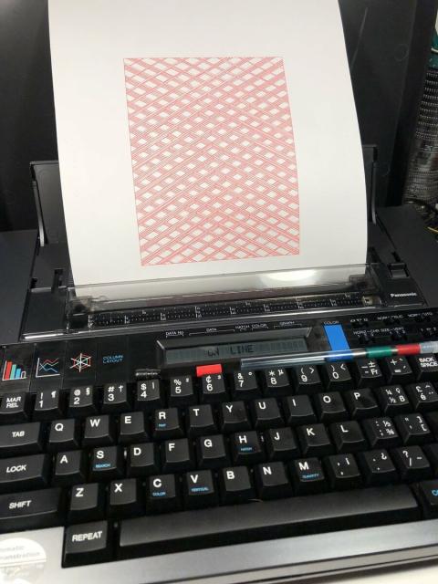 A Panasonic RK-P400C Penwriter typewriter plotter with paper in the platen that shows a geometric design of intersecting lines at a 45 degree angle with gaps that create diamonds with depth.