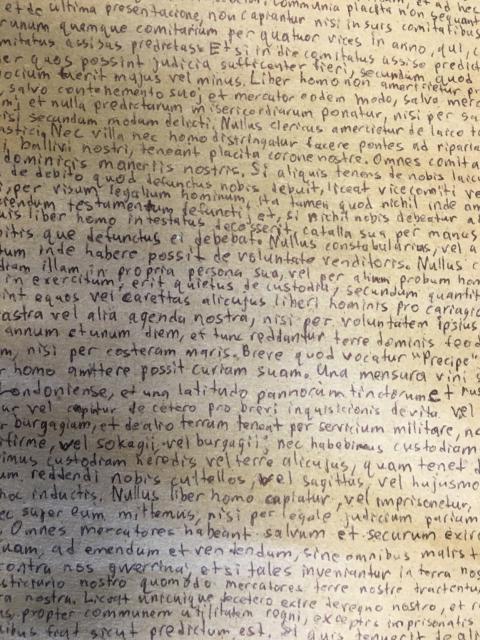 A close up of the Magna Carta text.