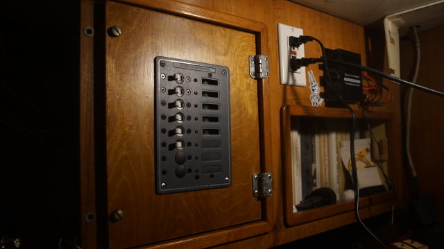 Breaker panel on a wooden door.