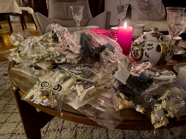 A pile of plastic bags filled with Lego parts