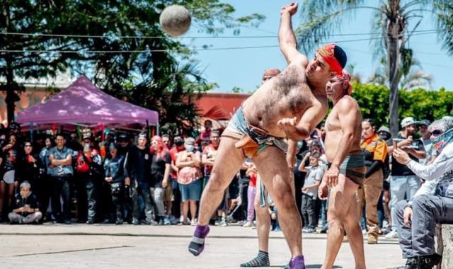 Man hitting a rubber ball with his hip during an ulama match in Sinaloa, Mexico.