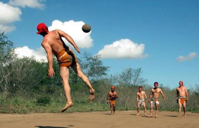 Man hitting a rubber ball with his hip during an ulama match in Sinaloa, Mexico.