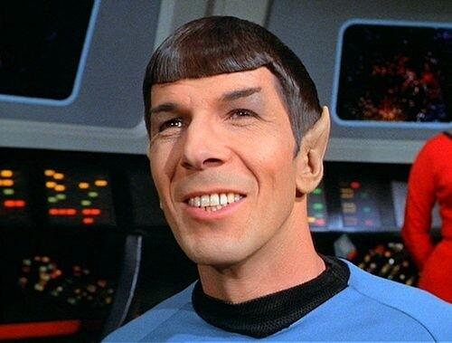 Spock from Star Trek wears an uncharacteristic smile, revealing a rare emotional moment
