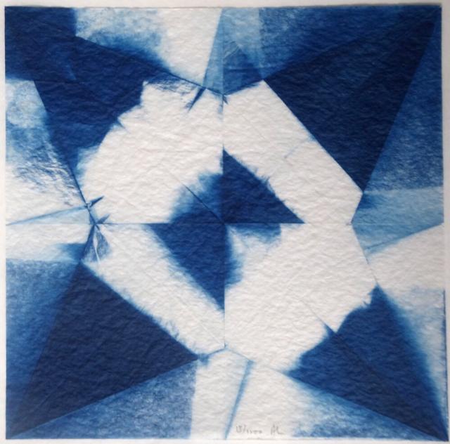 Square image in shades of blue and white, showing a geometric pattern equivalent to the shapes produced in a square of paper after being folded into an origami crane and then opened. The folds define triangles, diamonds and other shapes. Some areas are dark blue, some white, some tones of blue. In each one, the shapes are the same, but the blue and white is different.
