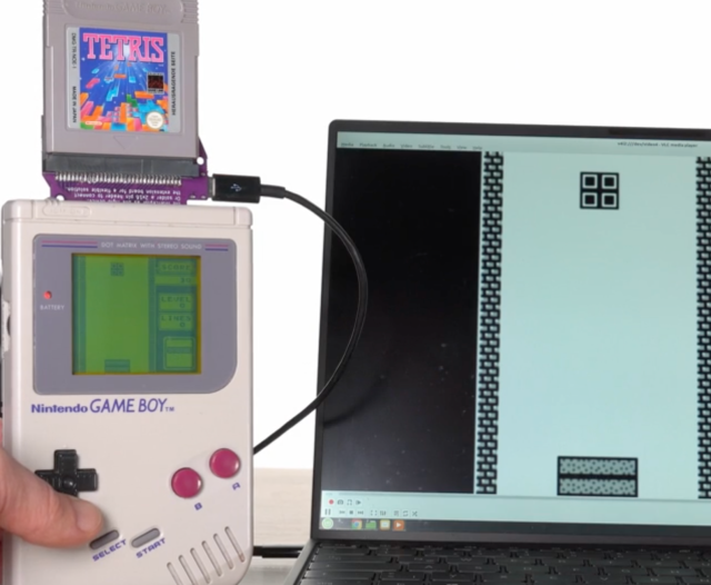 A Game Boy with a home made Raspberry Pi plug in in the cartrdige slot and Tetris plugged into it. Tetris is playing in back and white on the screen of a laptop next to it. From the RP2040-based Game Boy capture cartridge article. 