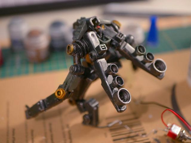 a cyclops robot made from clothespin and bead back, it has reactors hooked