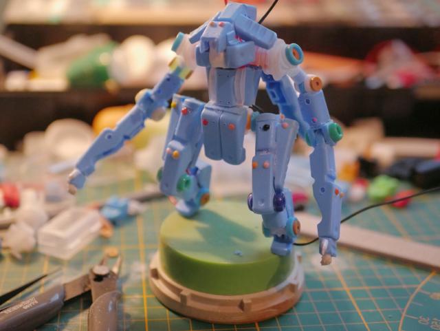 a work plan for model where we can see clothes pegs, beads, pliers and glue