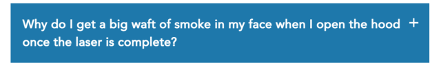 Screenshot of an FAQ from a laser cutter guide saying "Why do I get a big waft of smoke in my face when I open the hood once the laser is complete?"