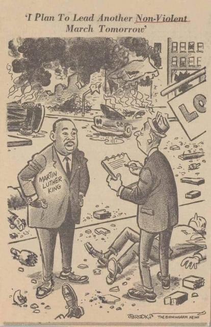 B&W newspaper cartoon: MLK stands on a sidewalk full of debris amidst a burning city while a dismayed-looking white reporter interviews him. Caption:  "I plan to lead another NON-VIOLENT march tomorrow."
