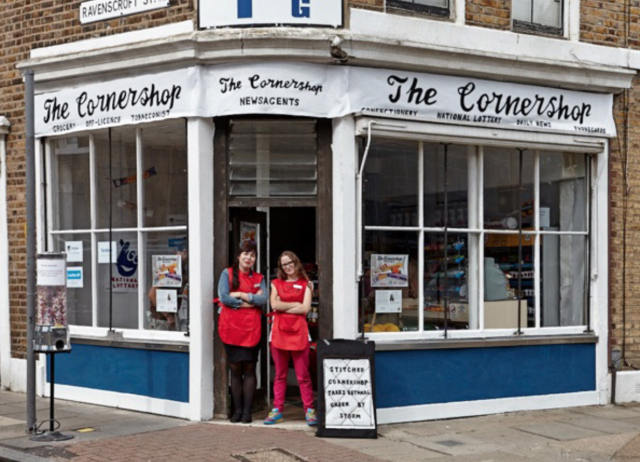 Lucy Sparrow stands outside her supermarket art installation...everything made of hand sewn felt