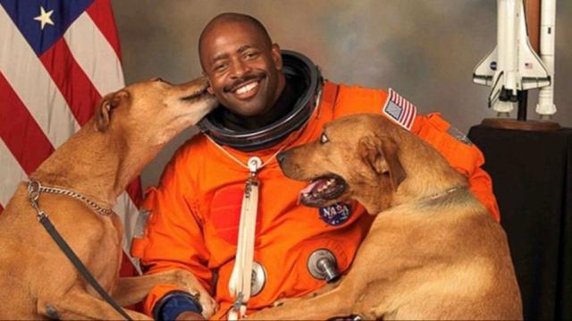 Astronaut Leland Melvin with his rescue dogs, Jake & Scout. Credit: NASA