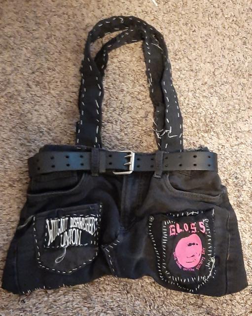 jurse (jort purse), black denim shorts made into a purse with various band patches and hand sewn with waxed dental floss 
