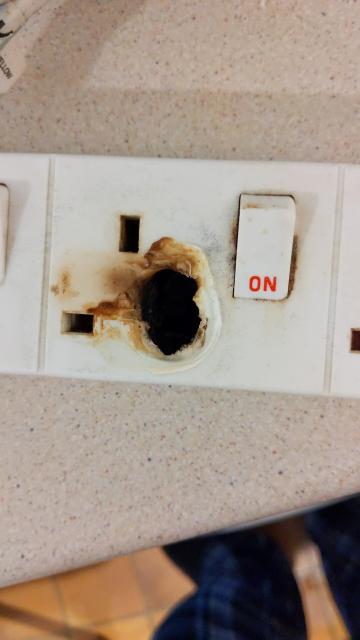 An electrical extension socket that melted.