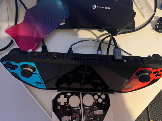 Steam Deck in a JSAUX M.2 SSD Dock, with the Project Killswitch back-cover on.