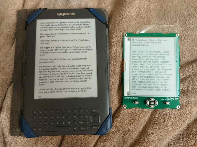 2010 kindle keyboard next to the open book - the open book is less than half the size.