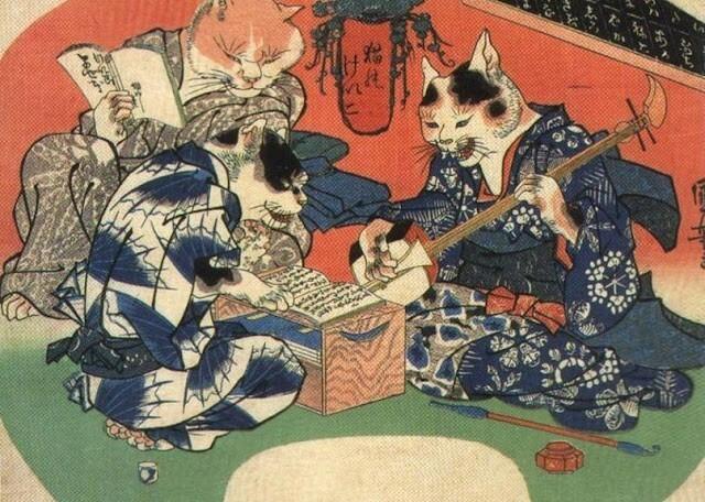 Three cats sit around a low table dressed in human clothes. Two hold books and one plays a shamisen.