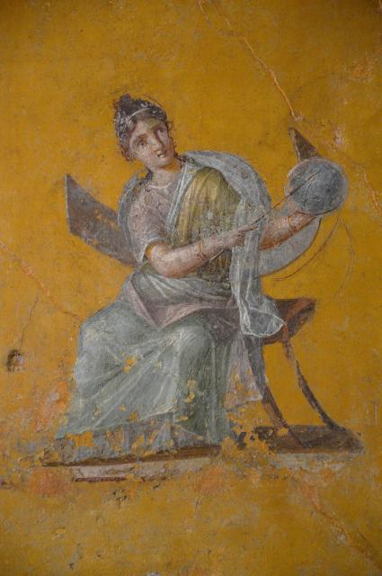 Urania, the Greek Muse of Astronomy sitting on a chair (this chair seems to be less a chair and more like a tool) with the Celestial Sphere/Orb/Globe. From the House of Julia Felix in Pompeii, 62-79 AD.

Carole Raddato via Flickr. (CC BY-SA 2.0)