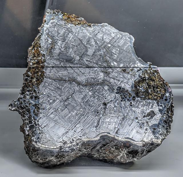 A piece of the Seymchan Meteorite, it was first found in Magadanskaya Oblast, Russia in June 1967.

Dsdugan, CC0, via Wikimedia Commons.