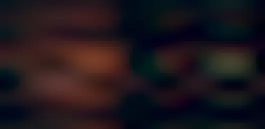 Pictured are two red nebulas on the far left and center, and a comet complete with a green coma and a long blue ion tail on the far right.