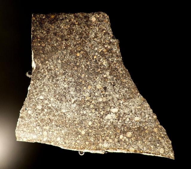 Seen here is a slice of the Moorabie Meteorite, which fell before 1965 in Australia.

Sample at the Museum fur Naturkunde, Berlin.

Daderot, CC0, via Wikimedia Commons.