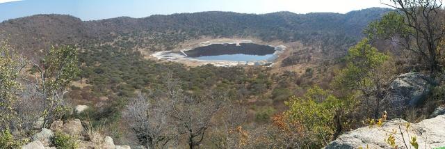 View of the Tswaing impact crater, South Africa; its age is estimated to be 220,000 ± 52,000 years old.

Martin Tuchscherer, CC BY-SA 3.0, via Wikimedia Commons.