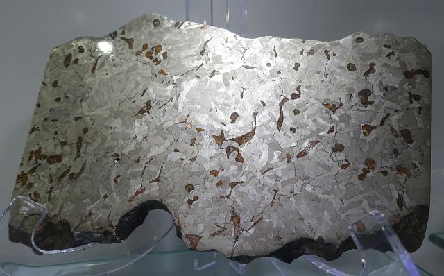 The Weekeroo Station Iron Meteorite was found 1924 in Australia; photo showing etched surface taken at the Center for Meteorite Studies, Arizona State University.

Daderot, CC0, via Wikimedia Commons.