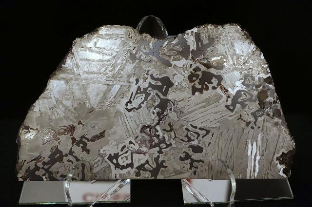 A piece of the Seymchan Meteorite, it was first found in Magadanskaya Oblast, Russia in June 1967.

Daderot, CC0, via Wikimedia Commons.