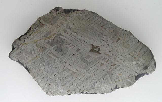 Etched slice of the Toluca meteorite (first find date uncertain, Mexico ~1776). Exhibit in the Naturmuseum Freiburg, Germany.

Daderot, CC0, via Wikimedia Commons.