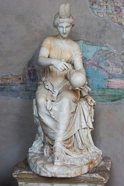 "Seated statue, restored as Urania; the body is late 1st to early 2nd cent. AD and comes from Tivoli, in the area of the so-called Villa of Cassius. The head is from the first half of the 2nd century AD; Vatican Museums, Museo Pio Clementino, Statue Gallery, Inv. 746."

Fabrizio Garrisi, CC BY-SA 4.0, via Wikimedia Commons.